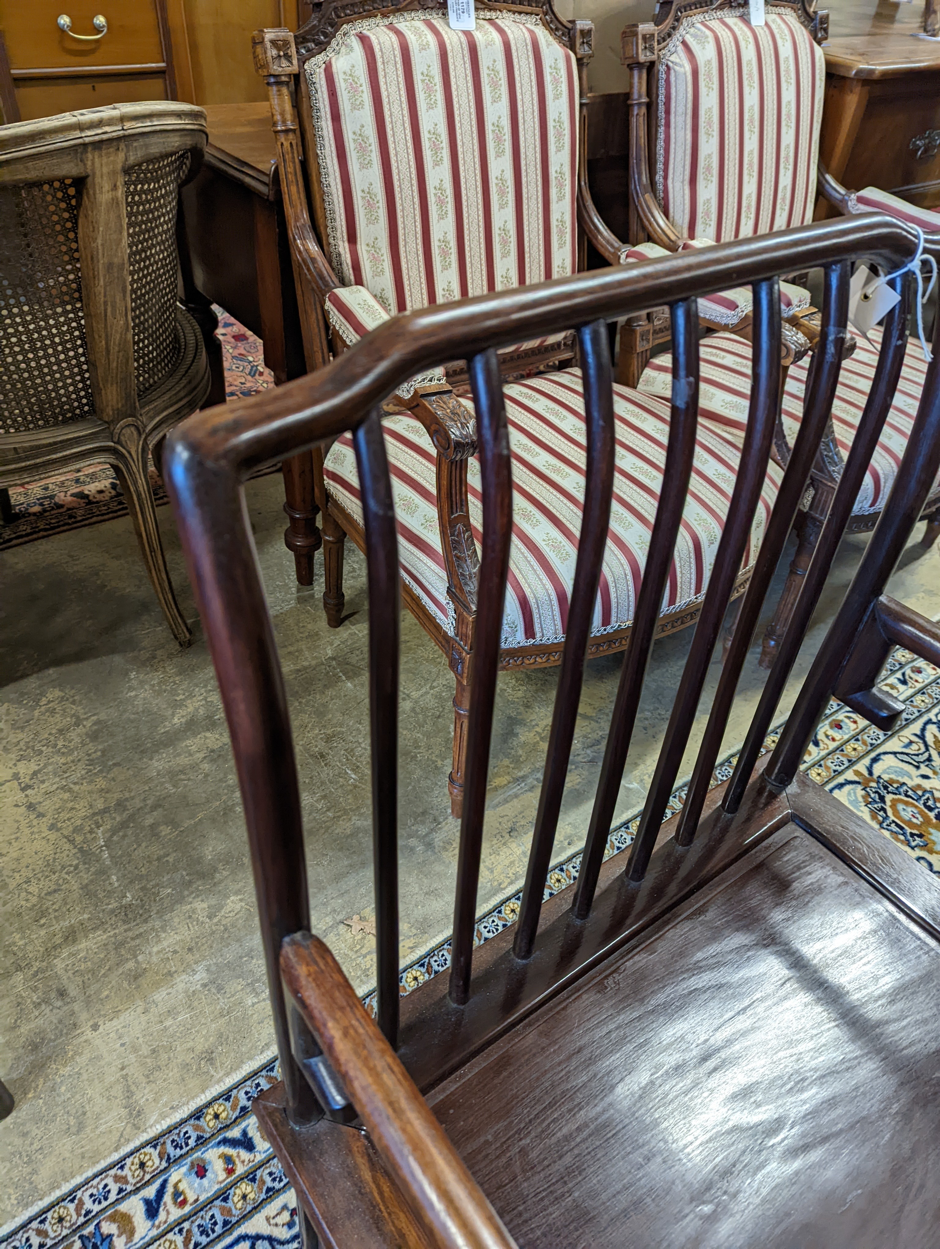 A pair of mid 20th century Chinese Hongmu elbow chairs with cushion seats, width 58cm, depth 49cm, height 92cm